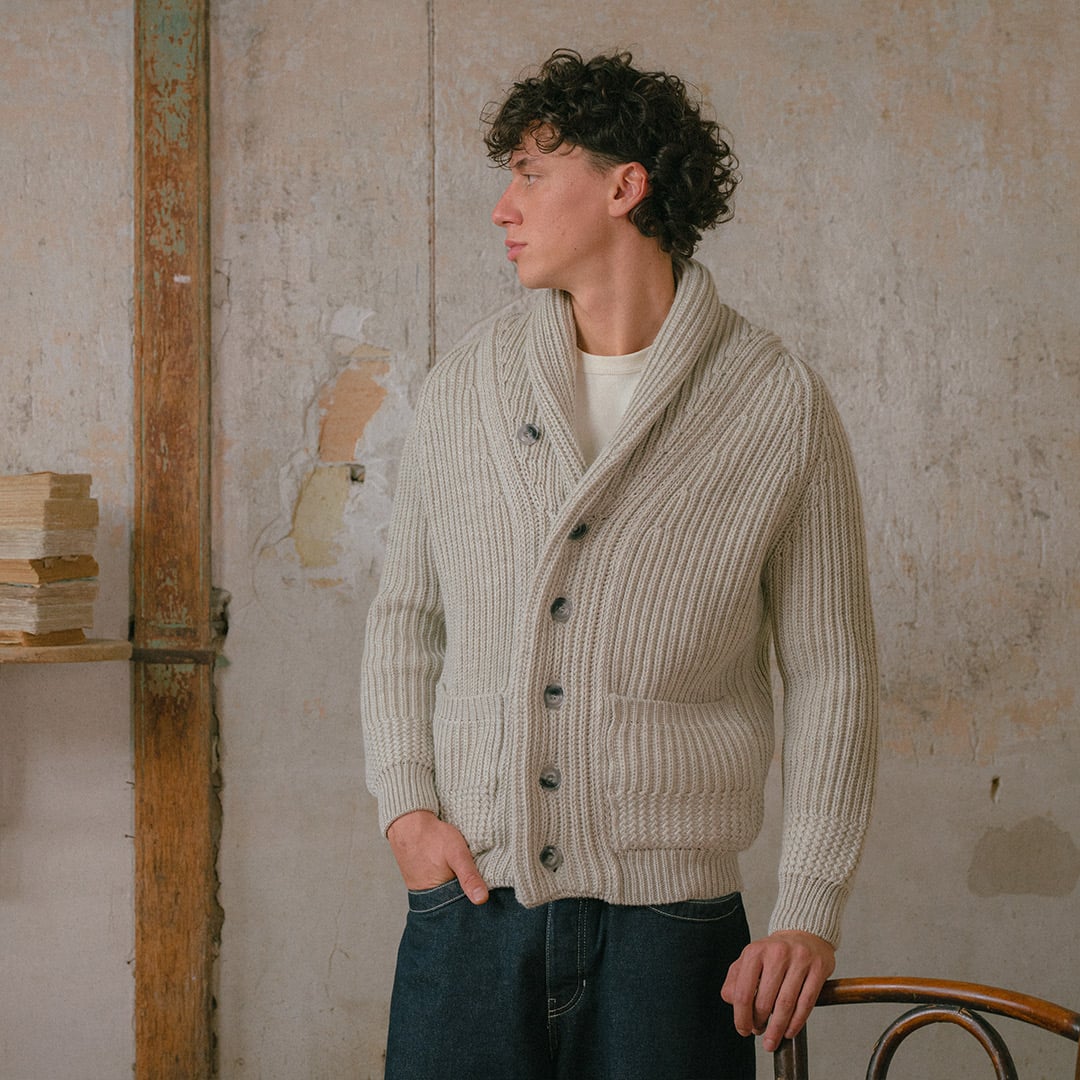 A man wearing the Bleu de Chauffe cardigan