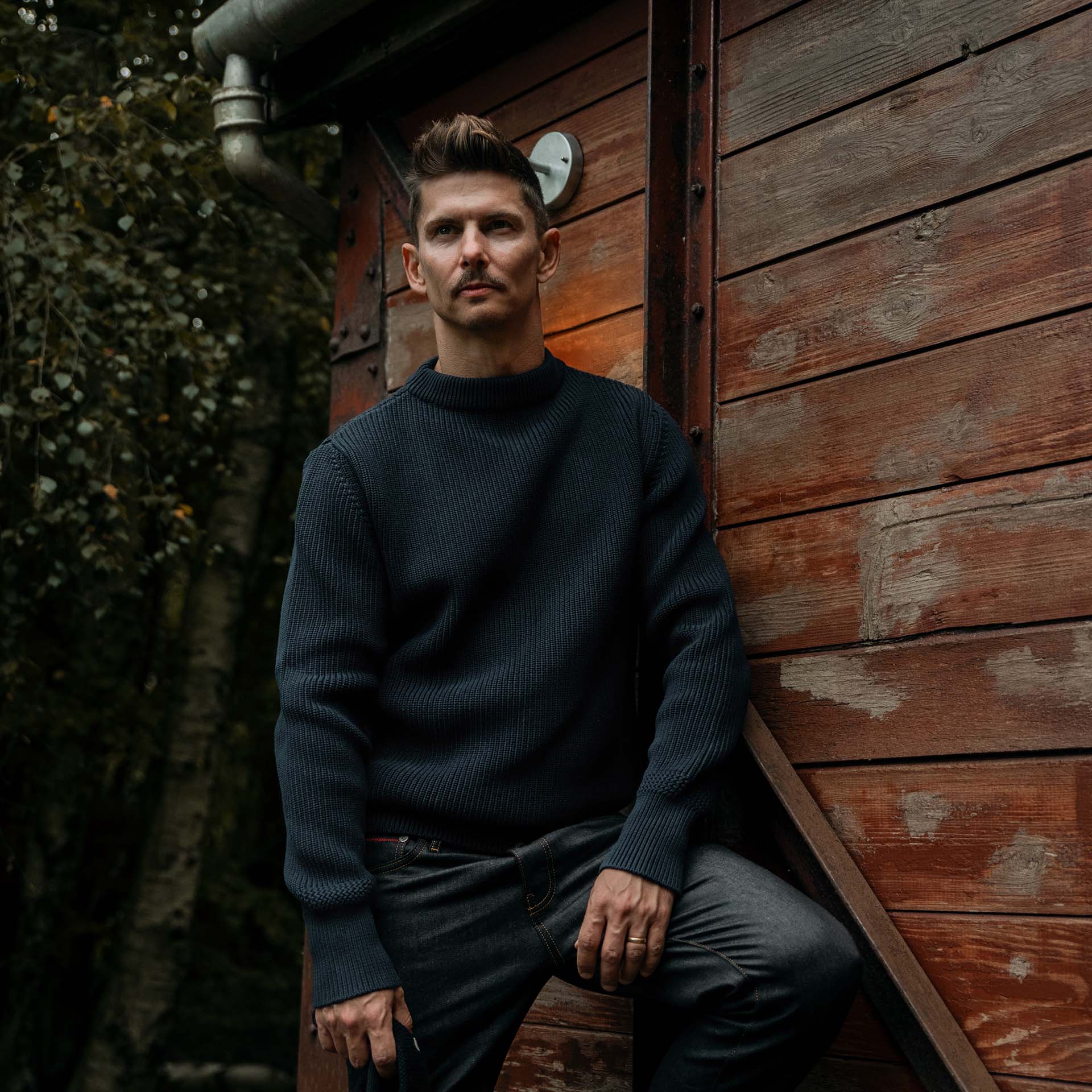 A man poses with the prenium sailor sweater made by hand in France. 