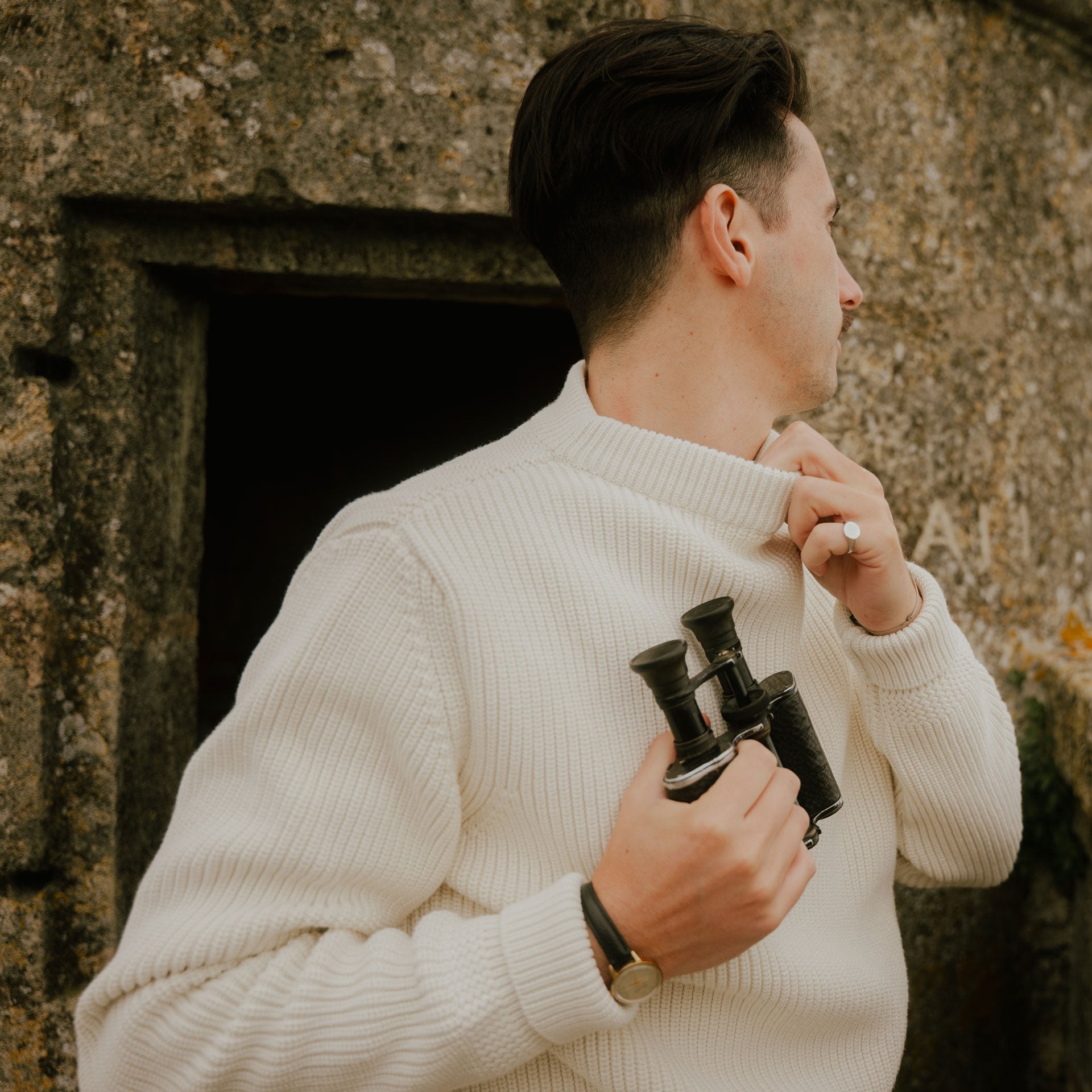 A man poses with the prenium sailor sweater made by hand in France.