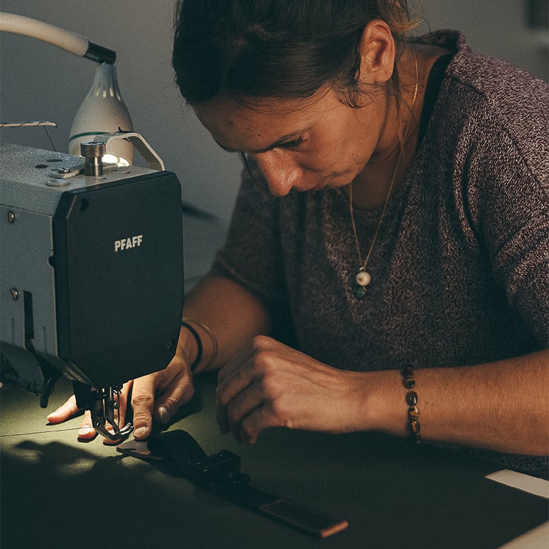 Artisan Bleu de Chauffe sewing a backpack