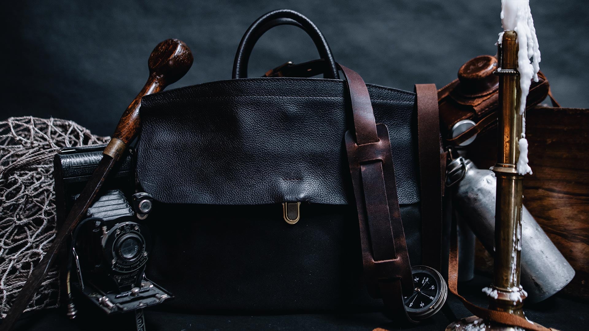 A man drinking coffee indoors with his Helios workwear bag